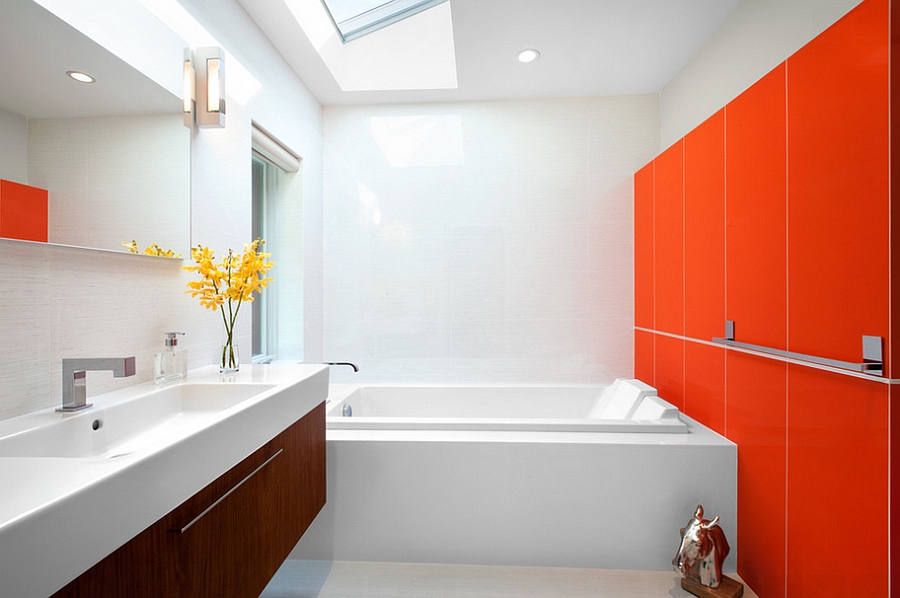 Intense orange in the contemporary bathroom steals the show [Design: CCI Renovations]