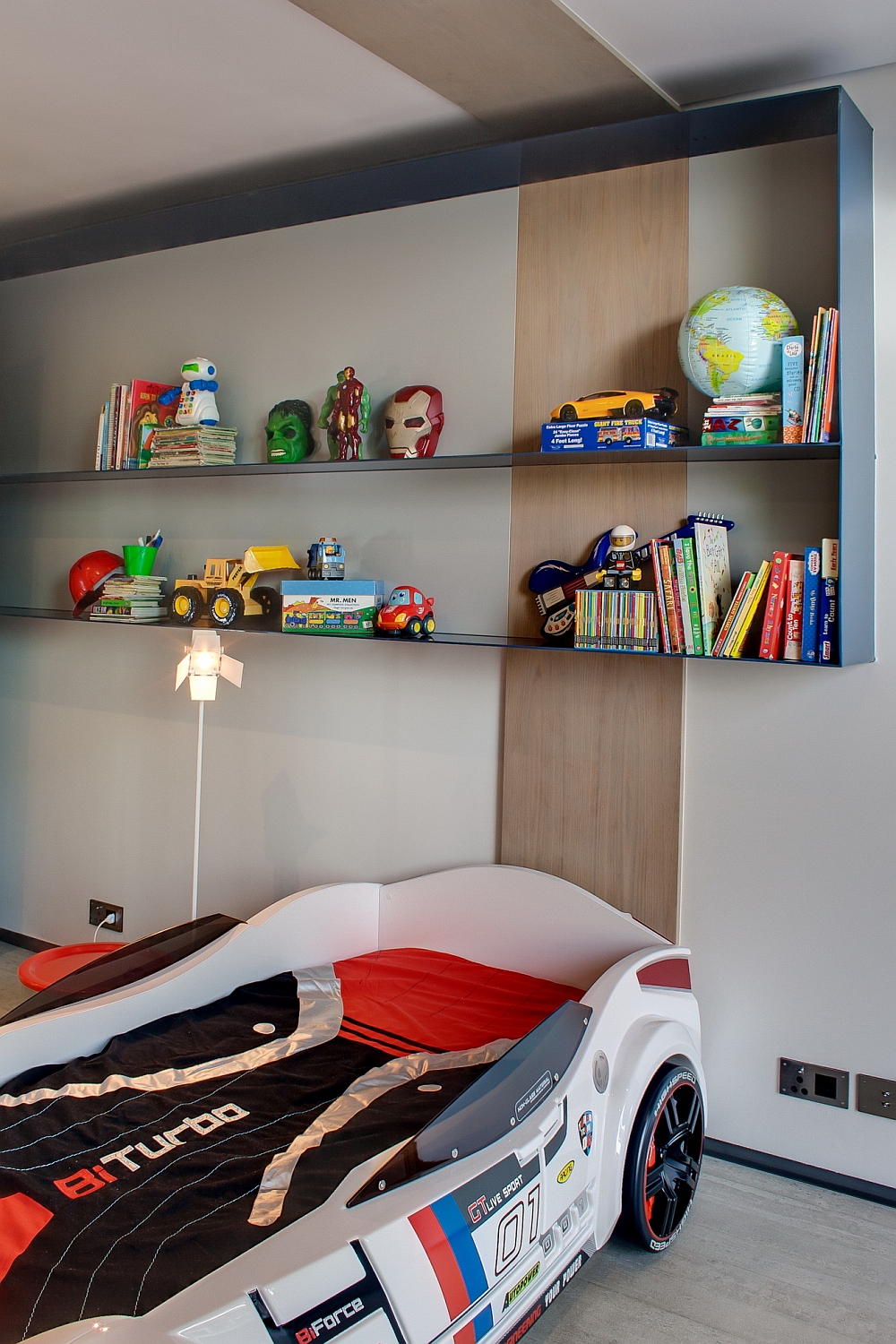 Kids' bedroom with a race car bed