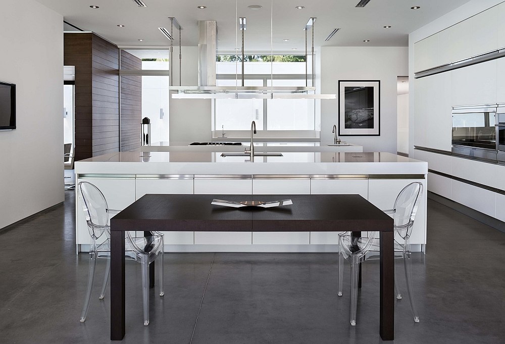 Kitchen and ining space in white with Ghost chairs