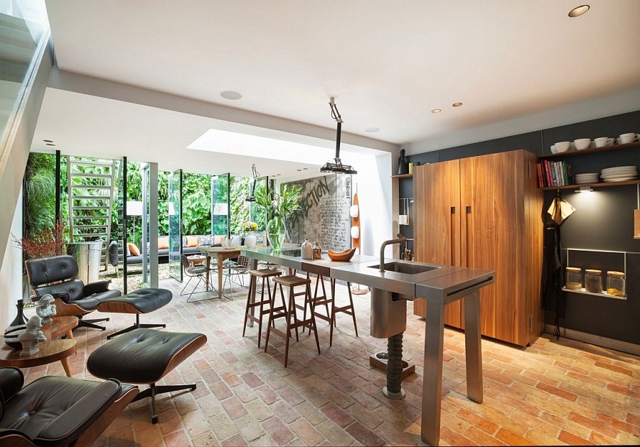 Kitchen connected with the patio outside features twin Eames Loungers