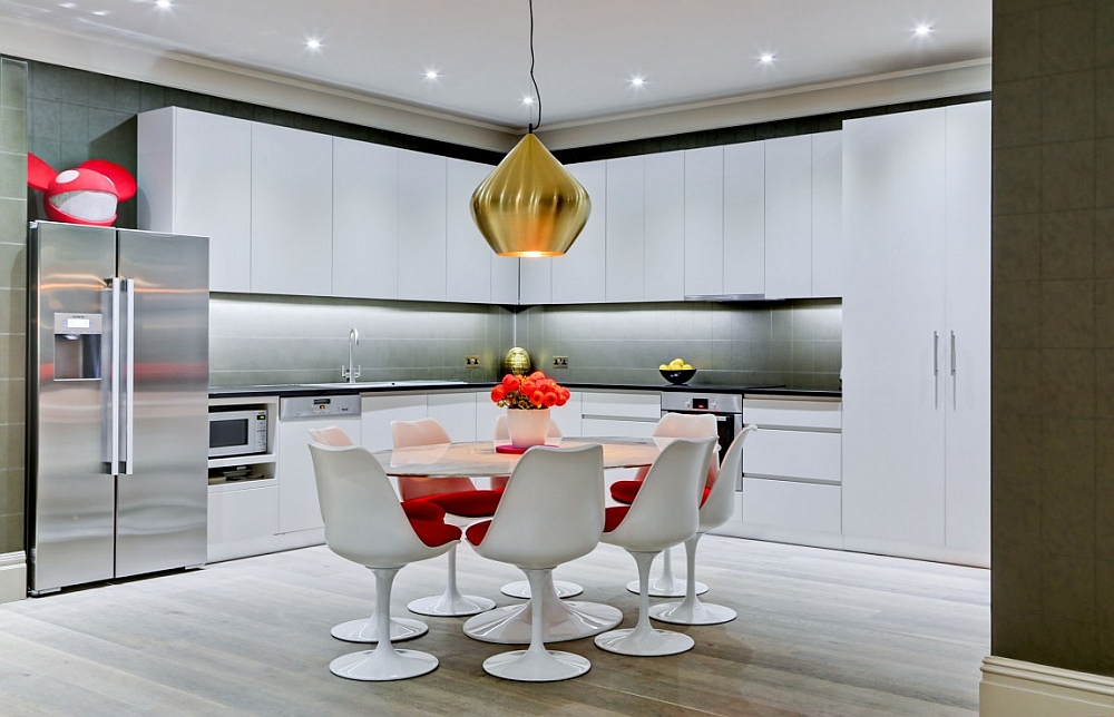 Large Beat Stout Pendant from Tom Dixon adds metallic glint to the kitchen and dining space