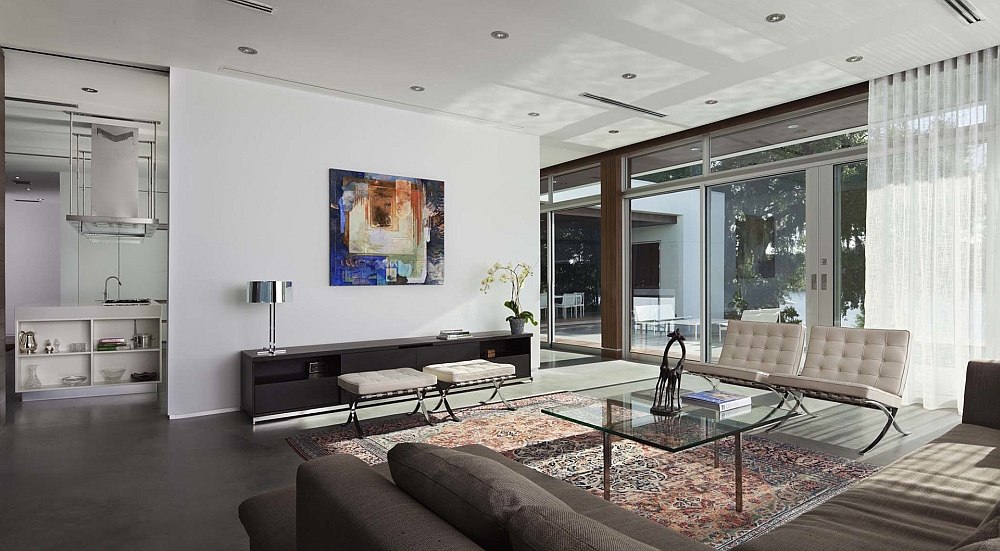 Large sliding glass doors and sheer curtains bring in plenty of natural light