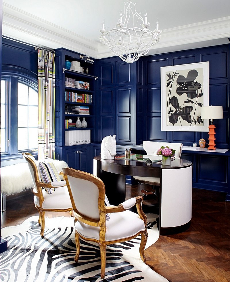 Leather desk and antique chairs add sophistication to the stylish home office