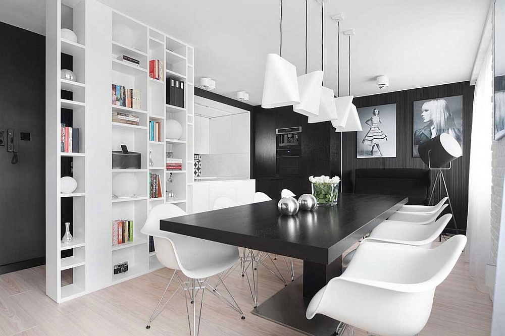 Lovely black and white photgraphs add to the monochromatic look of the apartment