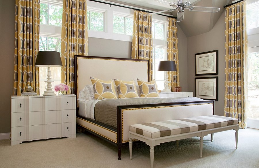 Lovely drapes accentuate the gray and yellow color palette in the room