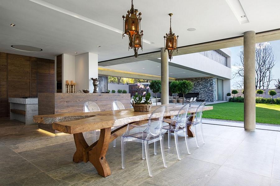 Lovely outdoor dining space and kitchen of the lavish Johannesburg house