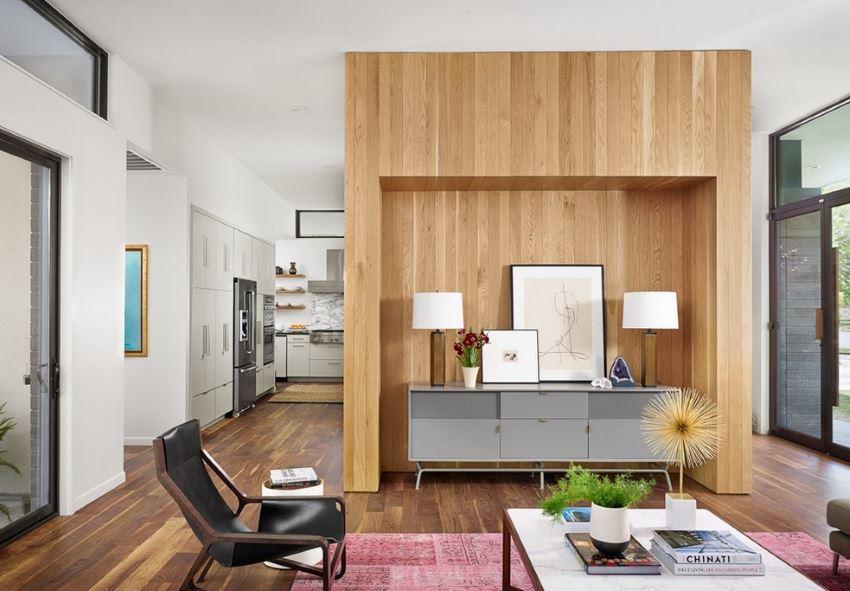 Magenta rug in a Midcentury living room