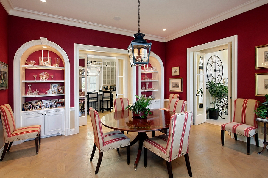 Mediterranean style dining room in ravishing red [Design: Cook Architectural Design Studio]