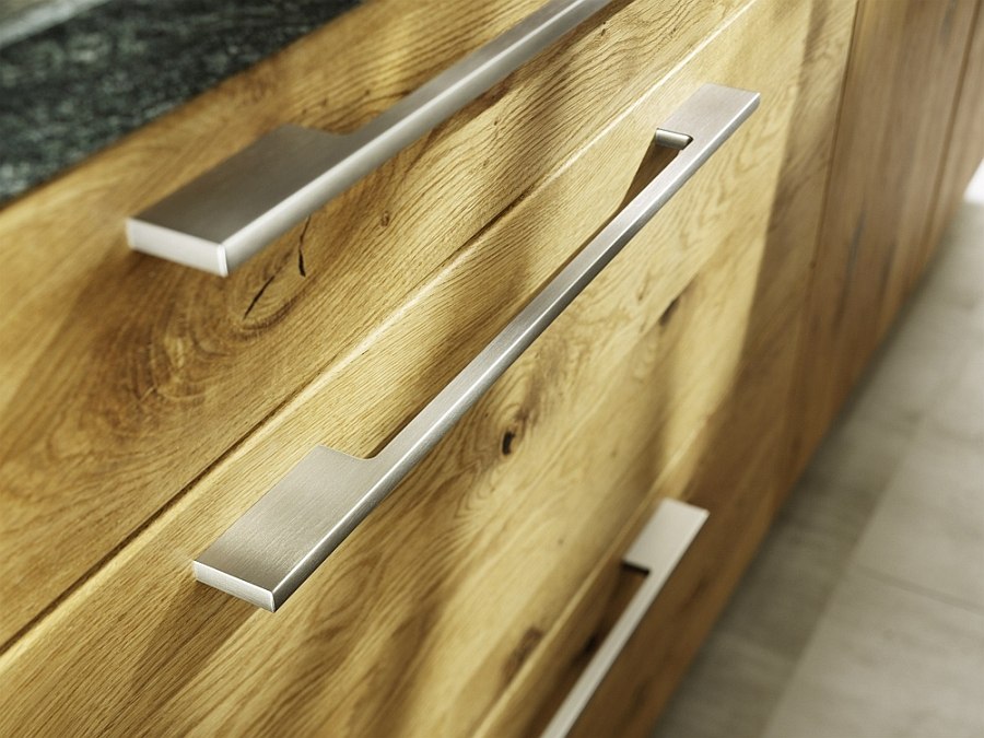 Metal handles complement the hand-sorted wooden surfaces  of the Loft kitchen