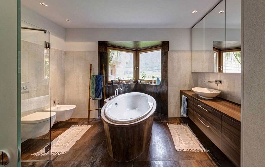 Modern bathroom with standalone bathtub and wooden vanity