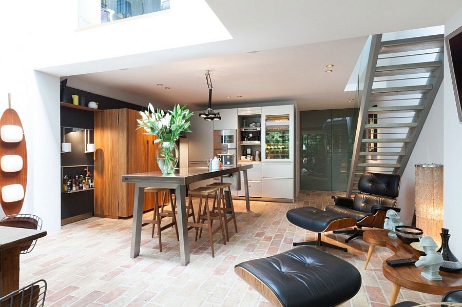 Modern kitchen with rough brick floor and natural finishes