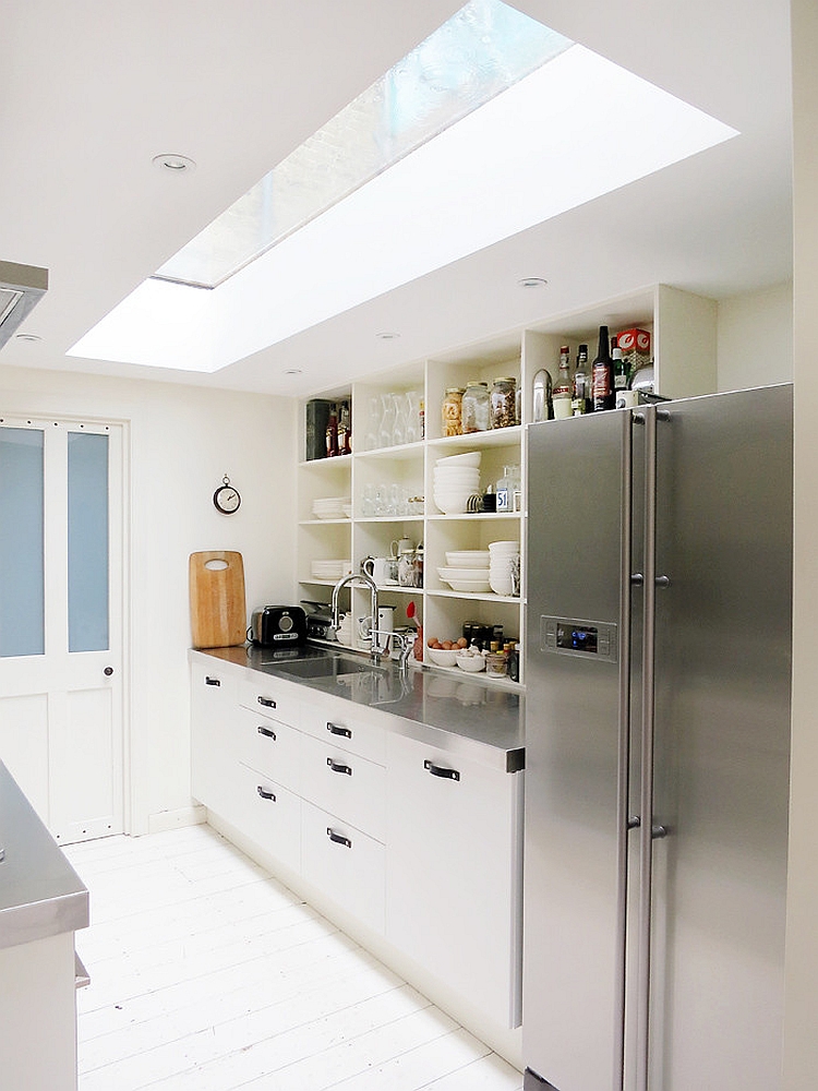 Narrow kitchen looks a lot more spacious thanks to the skylight