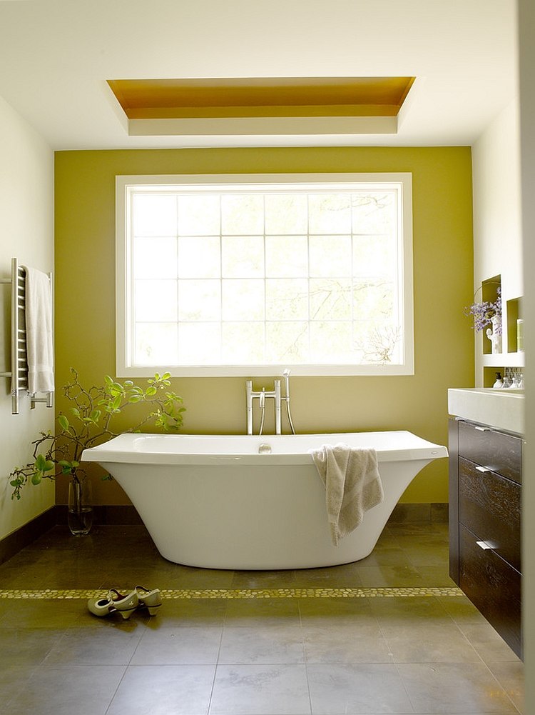 Natural light heightens the visual effect of green in this bathroom