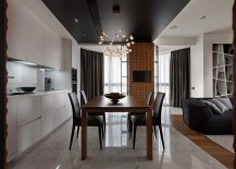 Open-plan-living-area-with-a-sleek-kitchen-and-smart-dining-space-217x155