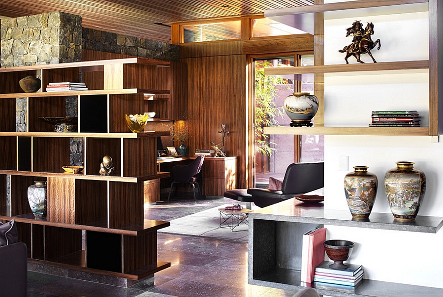 Open shelves separate the home office from the living area