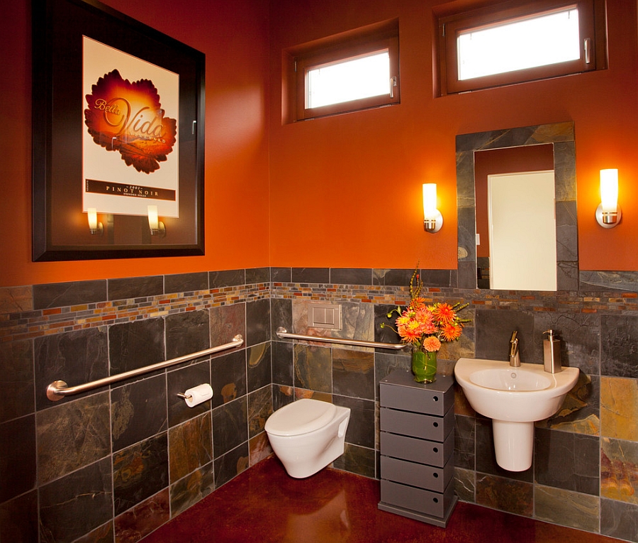 Orange brings dramatic charm to the cool bathroom