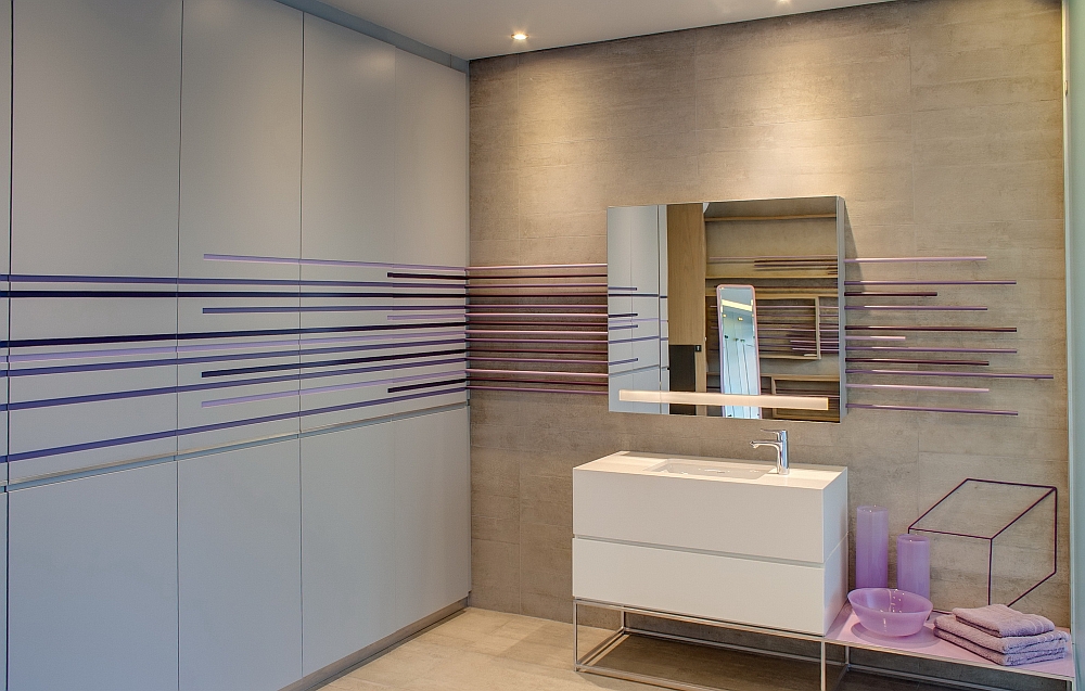 Pops of purple enliven the cool, contemporary bathroom