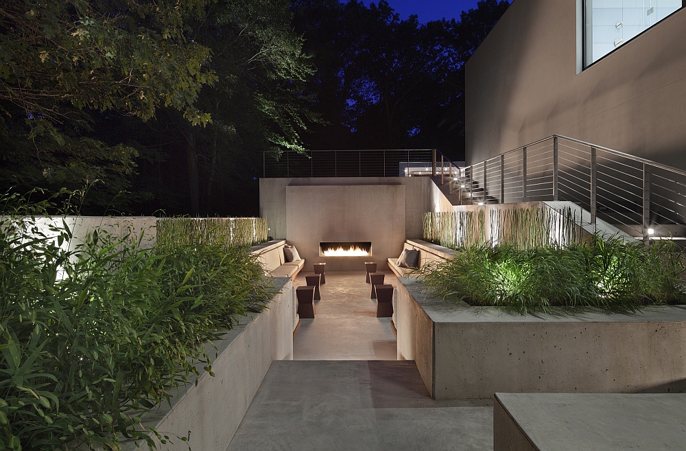 Private outdoor lounge with a fireplace