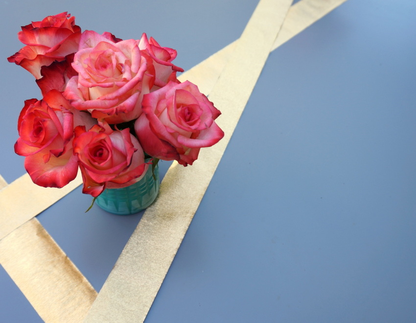 Red roses in a turquoise vase