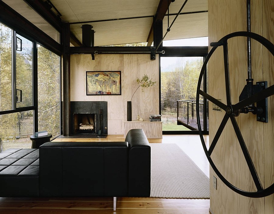 Refreshing living area of the cabin with glass walls