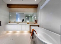 Restrained-use-of-wood-in-the-posh-bathroom-as-an-accent-addition-217x155