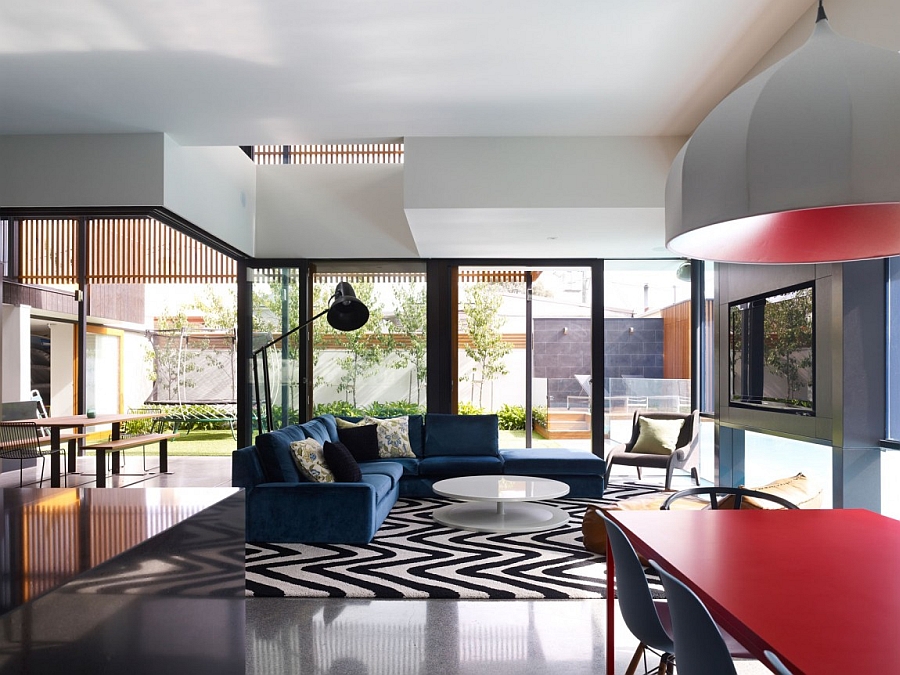 Sculptural lighting and a dash of red steal the show inside this Aussie home