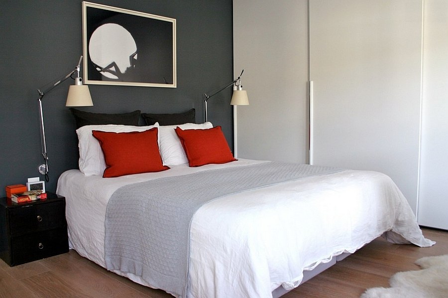 Simple yet elegant use of red accent pillows in the small bedroom with gray accent wall