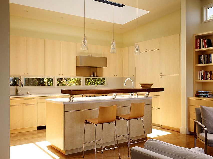 Skylight brings ample natural ventilation into the transitional kitchen [Design: John Maniscalco Architecture]