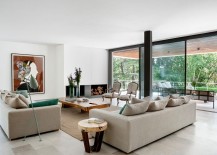 Sliding-glass-doors-connect-the-living-area-with-the-balcony-217x155