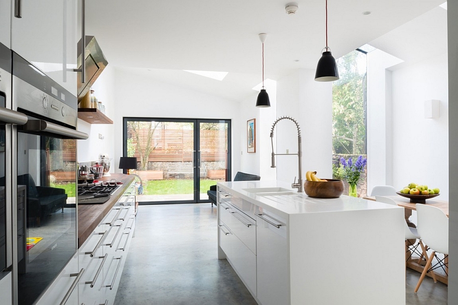 Slidinig glass doors connect the kitchen with the backyard