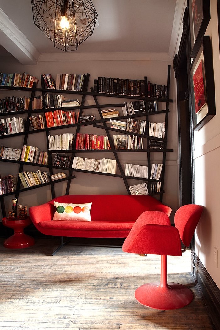 Snazzy bookshelf draws your attention instantly despite bright red decor! [From: Lisa Petrole Photography]