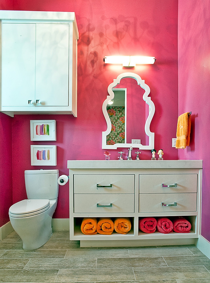 Splash of bold pink in the bathroom brings the space alive