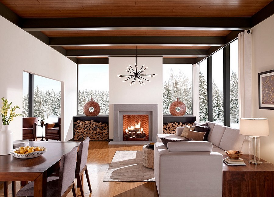 Stacked firewood flanks the fireplace and adds elegance to the room [Design: Eldorado Stone]