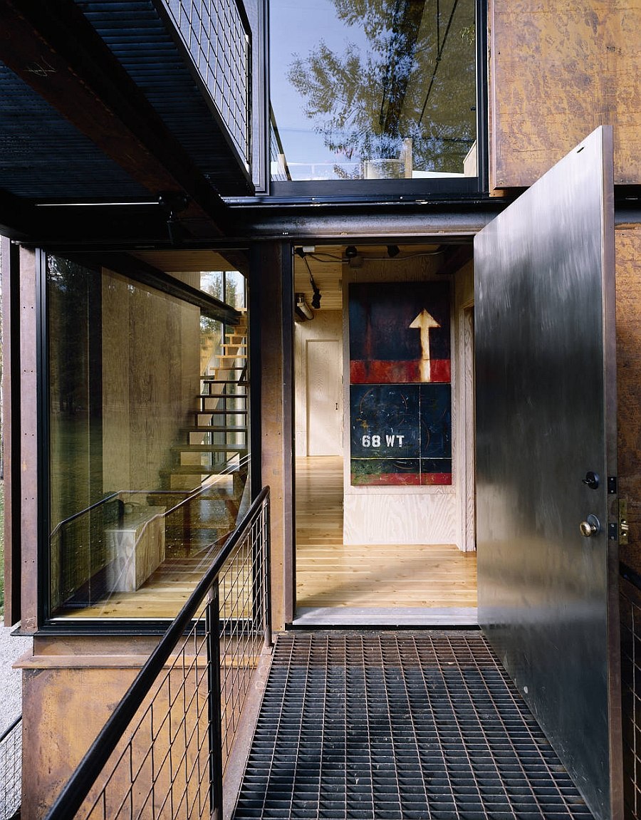 Steel walkway leading to the entrance of the cabin