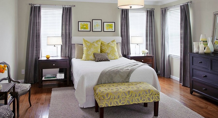 Stylish bench at the foot of the bed in yellow [Design: Tamsin Design Group]