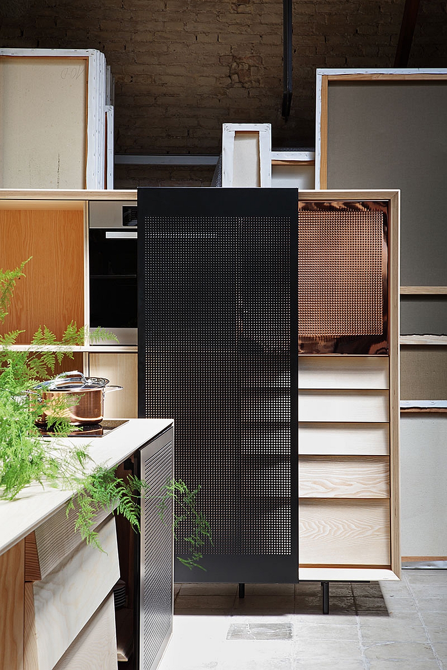 Tall wooden cabinet with sliding metal mesh door for the kitchen