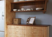 Traditional-dresser-next-to-the-fridge-gives-the-space-a-warm-cozy-appeal-217x155