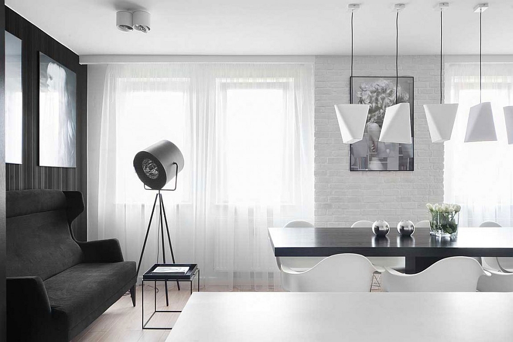 Tripod floor lamp gives the apartment a stylish, trendy appeal