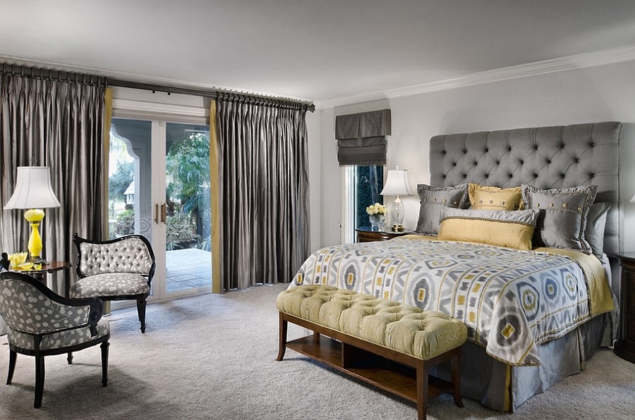 Tufted headboard and silken drapes give the room an air of luxury