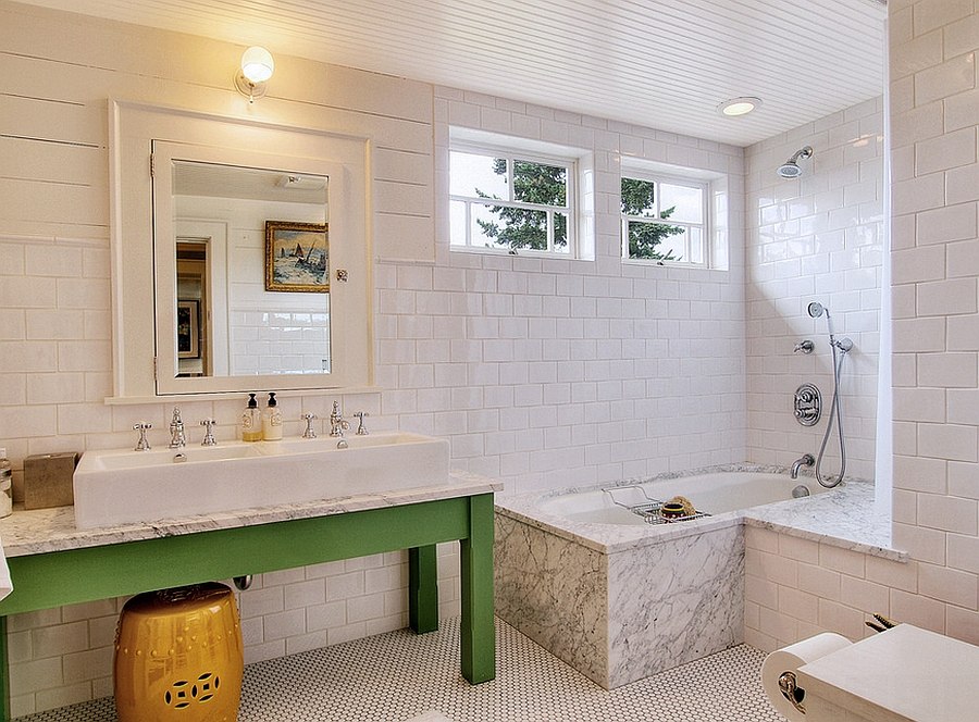 Vanity adds green to the lovely bathroom in white [Design: J.A.S. Design-Build]