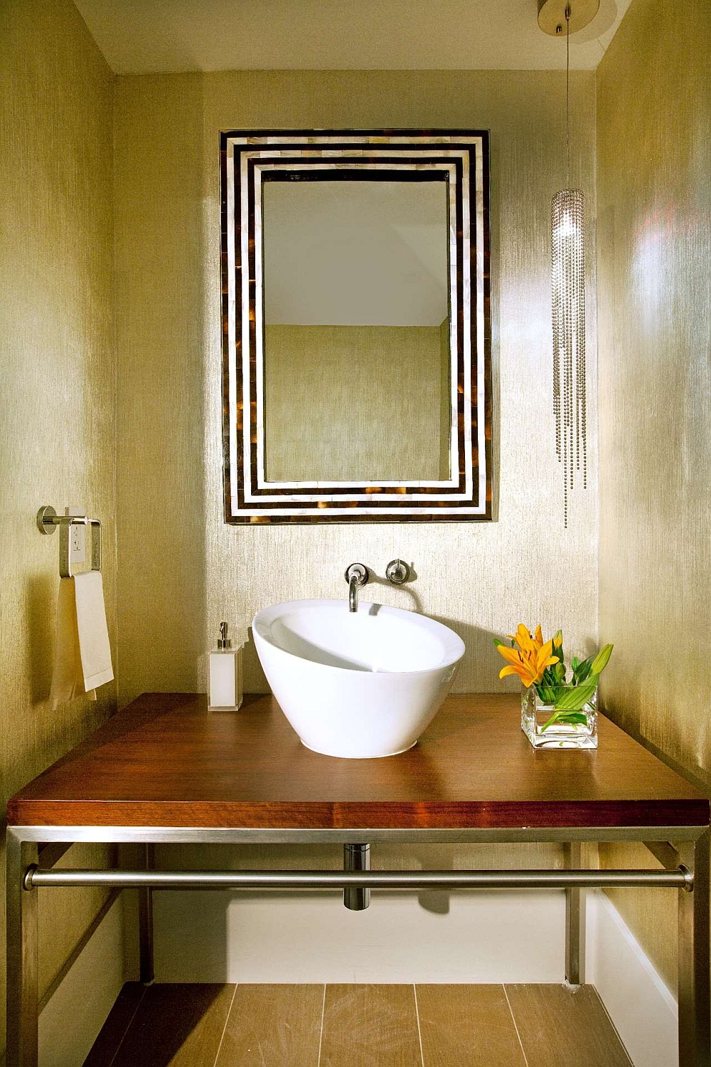 Wallcovering brings golden glint and texture to the powder room