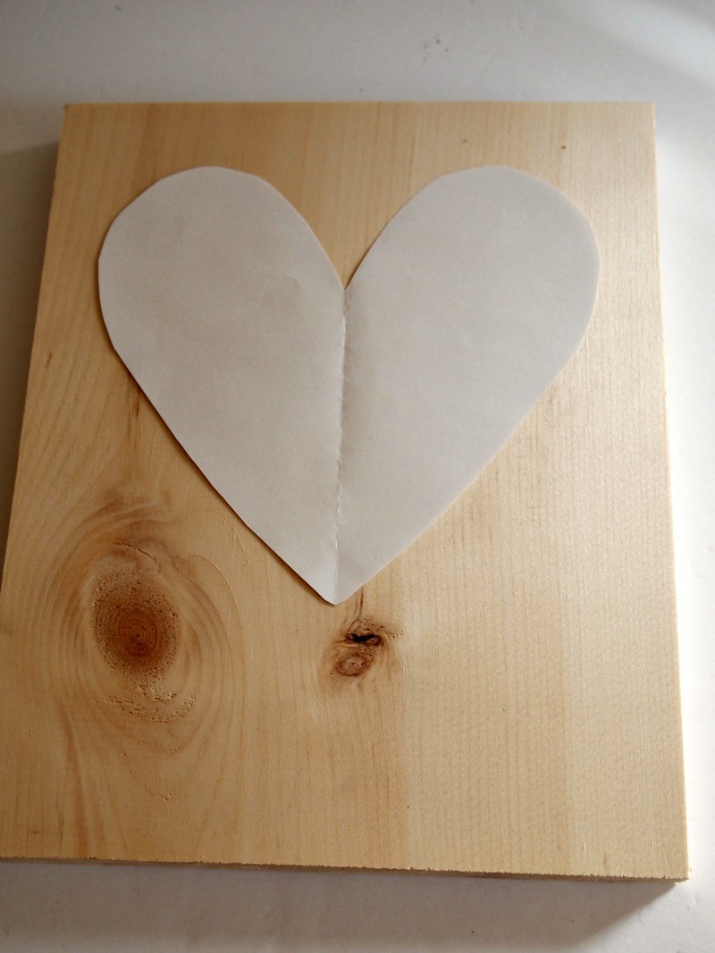 place-heart-template-on-sheet-of-pine