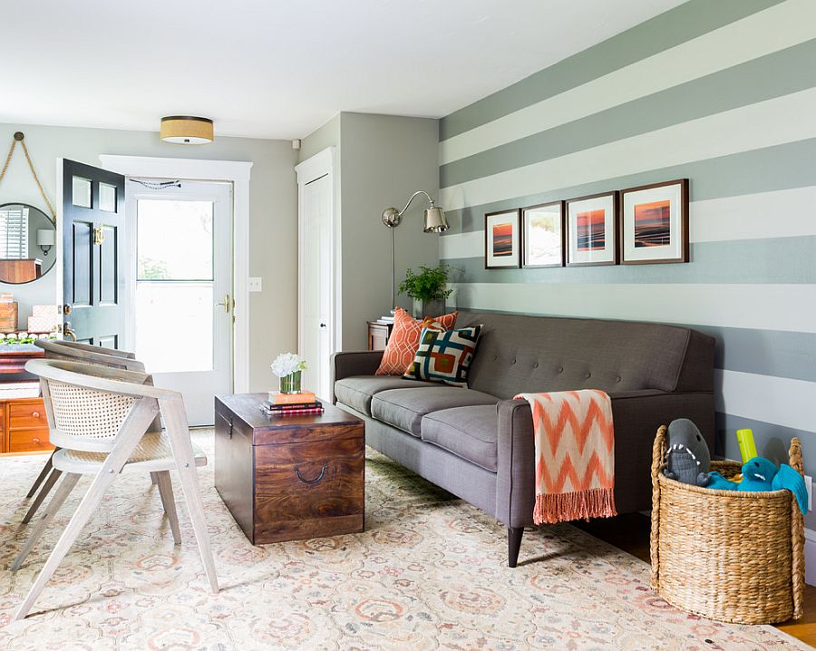 Beautiful living room looks perfect with a simple sofa and a striped accent wall