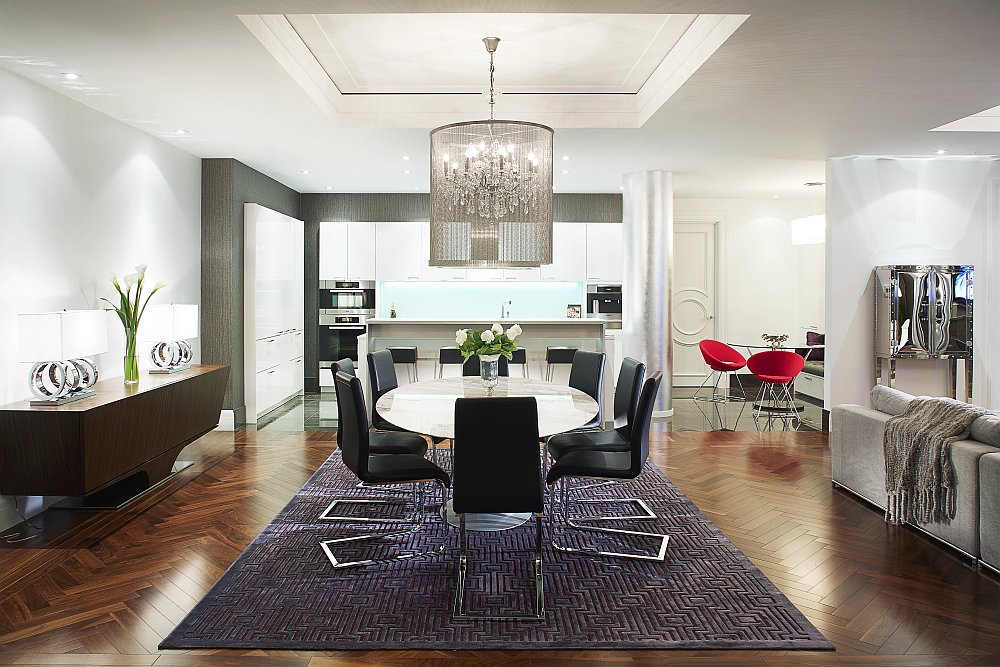 Brilliant chandelier above the dining table steals the show here