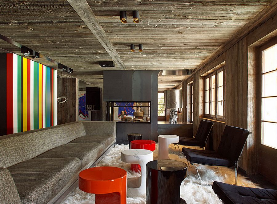 Colorful accent wall brings contemporary appeal to a rustic living room