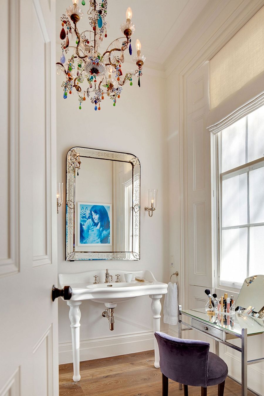 Colorful chandelier in the powder room steals the show