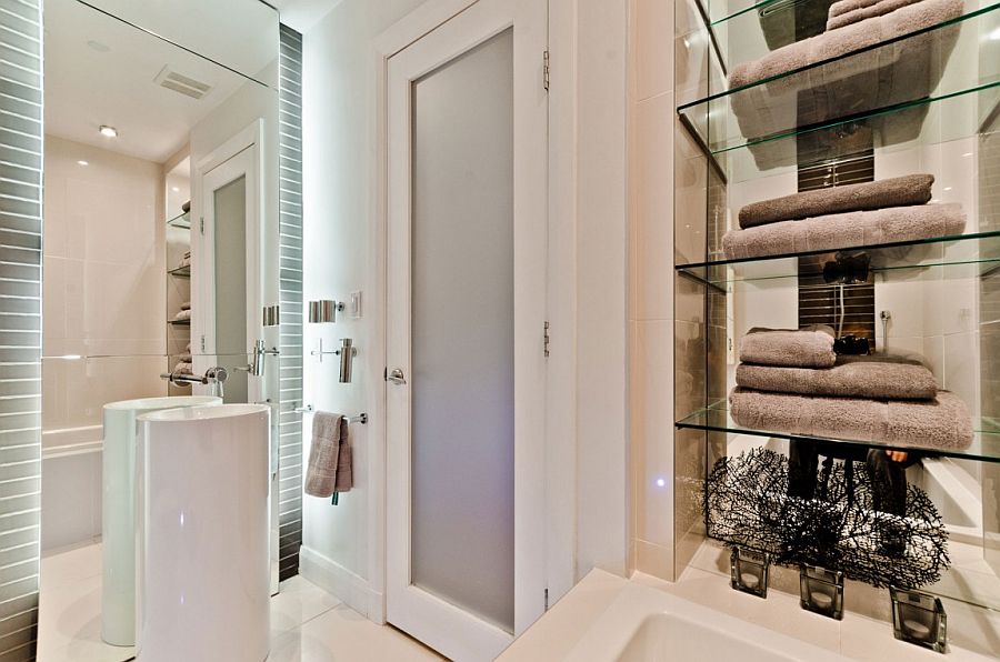 Contemporary bathroom with glass shelves for towel storage