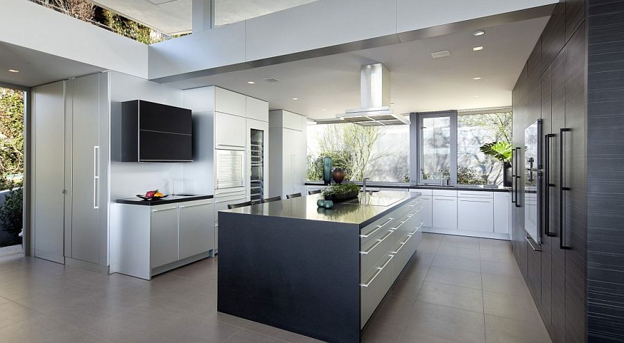 Contemporary kitchen in black and white with garden views