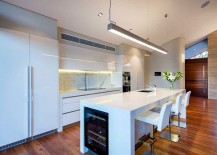 Contemporary-kitchen-in-white-with-smart-island-and-marble-backsplash-217x155