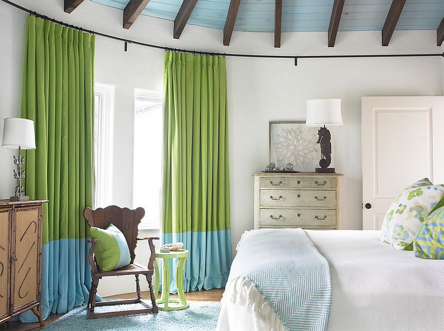 Curtains bring color and elegance to the beach style bedroom [Design: Carter Kay Interiors]